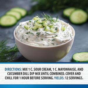 Cucumber Onion Dill Party Dip garnished with chopped cucumber and dill, with sliced cucumbers nearby and preparation directions and serving yield shown below.