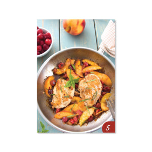 Chicken, peaches, and cranberries in a bowl.