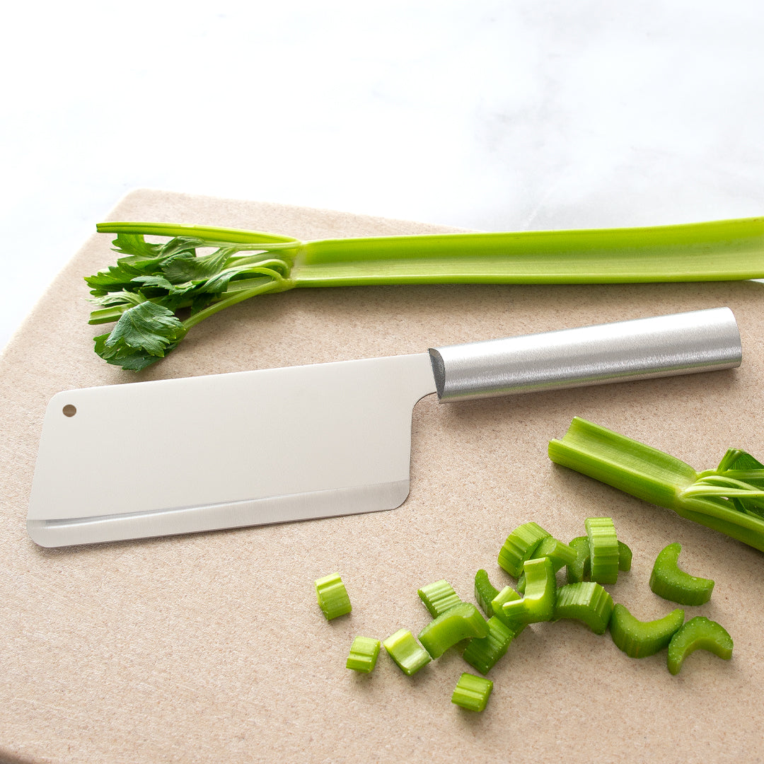 Silver Handle Chef's Dicer on a cutting board with chopped celery.