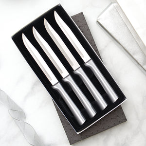 Four Utility/Steak Knives Gift Set with silver handles in a black-lined gift box.