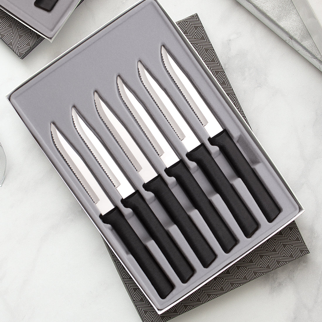 Rada Cutlery Six Serrated Steak Knives Gift Set with silver handles in black-lined gift box. 