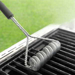 Rada Cutlery's new Grill Brush cleaning a grill grate.
