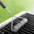 Rada Cutlery's new Grill Brush cleaning a grill grate.