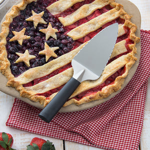 Serrated Pie Server with black handle and American-themed pie in pie dish