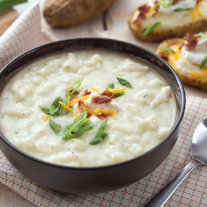 Prepared Baked Potato Soup in bowl garnished with green onions.