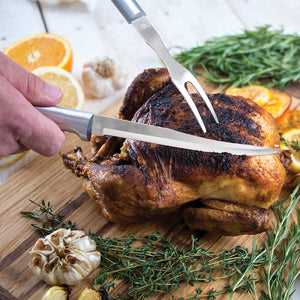 Rada Cutlery Carver/Boner Knife with silver handle carving whole chicken.