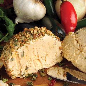 Jalapeno Cheeseball sliced with Rada Party Spreader, onions and peppers.