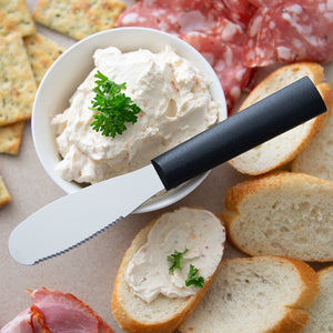 Party Spreader with black handle and cream cheese spread for baguettes. 