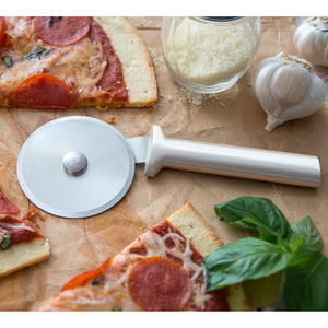 Pizza cutter with silver handle by pepperoni pizza, Parm, garlic & basil 