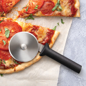 Rada Cutlery pizza cutter with black handle and steel wheel on pizza slice. 