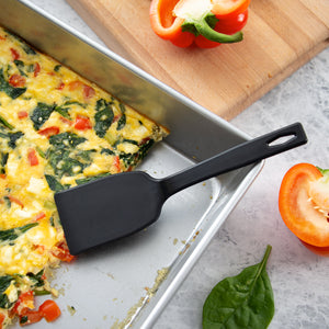 A small Rada Cutlery potluck spatula serving a pan of spinach and Feta egg bake.