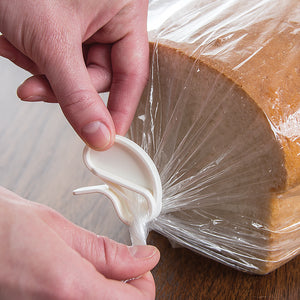 Sealing a bread bag by sliding on a Rada Quick Grip clip over the twisted end.
