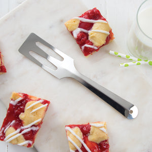 Silver serverspoon shown with cherry bars.