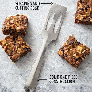 The Rada Cutlery Serverspoon with squares of chunky brownies. Scraping and cutting edge. solid one-piece construction.
