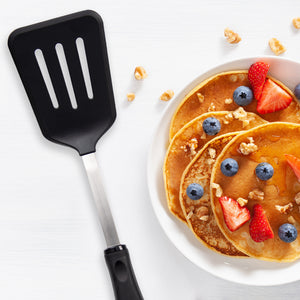 A non-scratch Slotted Turner with pancakes, blueberries, strawberries, and oatmeal.