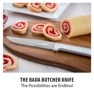 A Rada Cutlery Stubby Butcher knife slicing a roll of cookie dough. The Rada Butcher Knife. The possibilities are endless!
