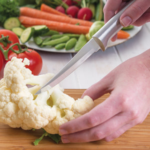 Super Parer knife with silver handle cutting cauliflower.