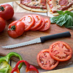 Tomato Slicer on wooden cutting board with sliced tomatoes and peppers.