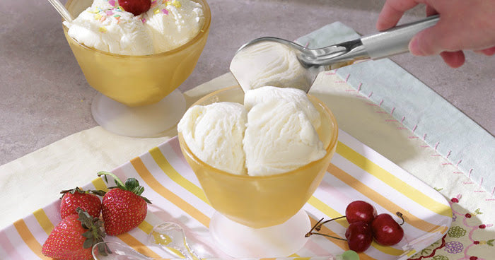Vanilla ice cream in yellow bowls with a RADA ice cream scoop spooning a serving of ice cream - R137