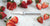 A Rada Granny Paring Knife in the middle of sliced red strawberries