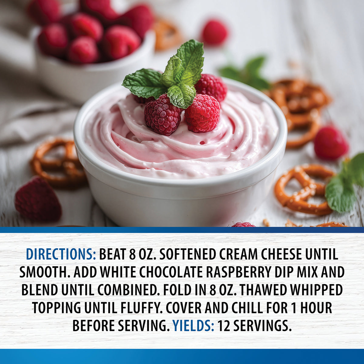 White Chocolate Raspberry Sweet Dip topped with fresh raspberries and mint, surrounded by pretzels and raspberries, with preparation directions shown below.