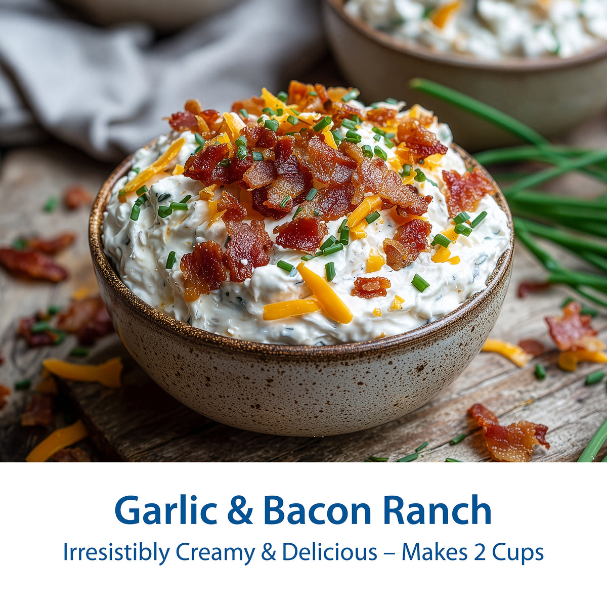 A ceramic bowl filled with Garlic & Bacon Ranch dip, topped with crispy bacon bits, chives, and shredded cheese, on a rustic wooden surface. Text at the bottom reads 'Garlic & Bacon Ranch' and 'Irresistibly Creamy & Delicious – Makes 2 Cups'.