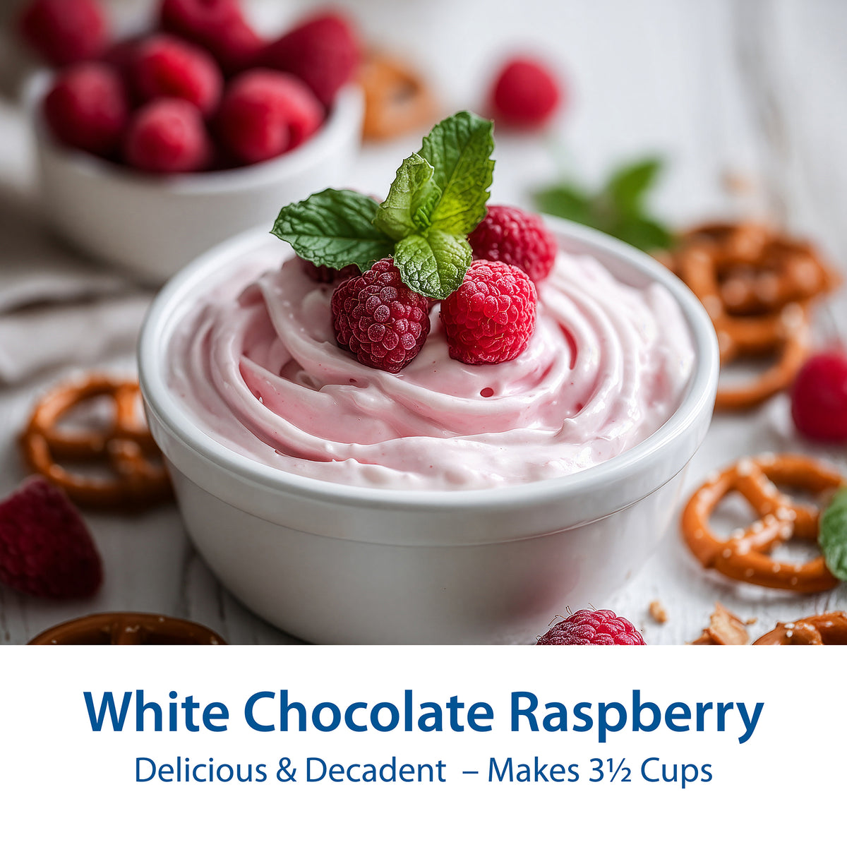 A white bowl filled with pale pink whipped dessert topped with fresh raspberries and mint leaves, surrounded by pretzels, additional raspberries, and a text banner at the bottom reading 'White Chocolate Raspberry Delicious & Decadent – Makes 3 1/2 Cups'.