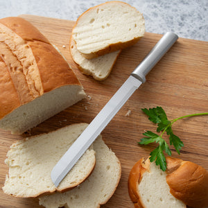 8" Bread Knife by Rada Cutlery propped up on piece of sliced bread.