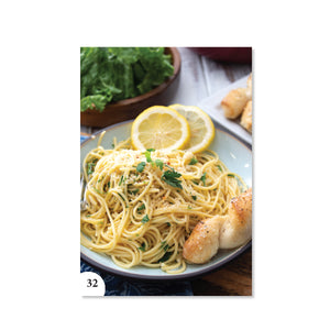 Page 32 shows a plate of Garlic Spaghetti with breadsticks and lemon slices. 