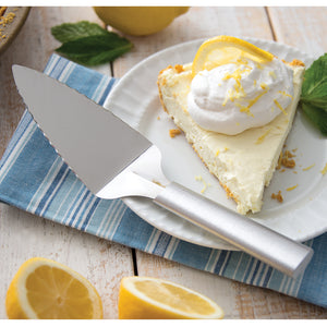 Serrated Pie Server with silver handle and lemon cheesecake slice with whipped topping and lemon.