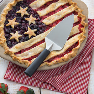 Serrated Pie Server with black handle and American-themed pie in pie dish 