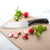 Rada Cutlery Anthem Wave Cook's Knife on cutting board with sliced radishes