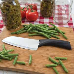 Anthem Wave Cook's Knife on a wooden board with sliced green beans ready for canning.