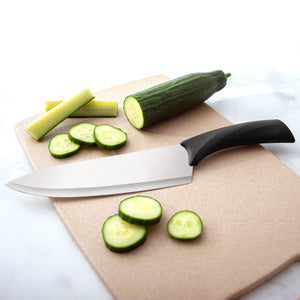 Anthem Wave French Chef Knife with sliced cucumbers on a cutting board. 
