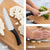 Rada Cutlery Anthem Wave French Chef Knife with minced herbs on a wooden cutting board.