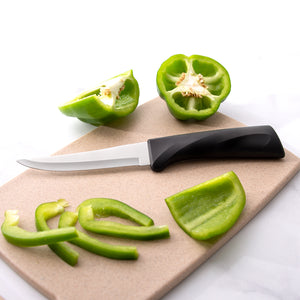 Anthem Wave Super Parer on cutting board with sliced green peppers. 