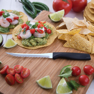 Anthem Wave Tomato Slicer on a board with taco ingredients. 