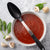 Rada Cutlery Non-Scratch Basting Spoon over bowl of red pasta sauce with mushrooms and basil. 