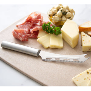 Cheese knife with silver handle and an assortment of cheese and meat.