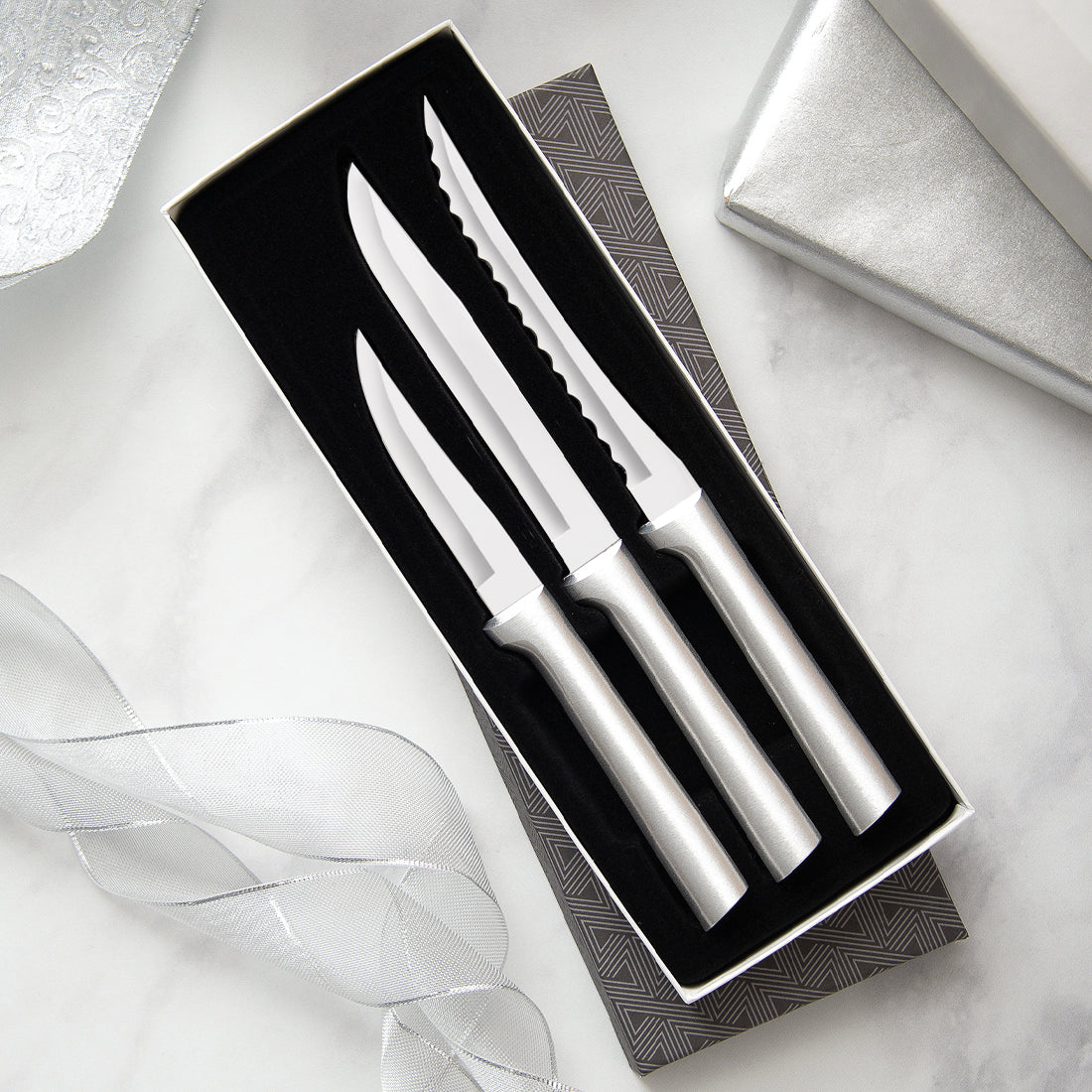 3-piece Cooking Essentials Gift Set with silver handles in a black-lined gift box