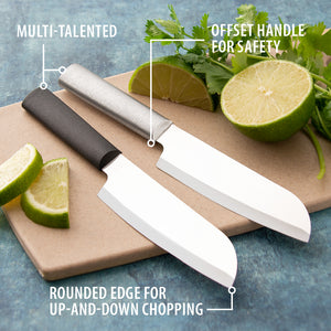 Cook Utility knives on a board with limes. Multi-talented. Offset Handle for safety. Rounded edge for up-and-down chopping. 