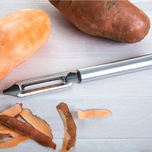Rada Cutlery Deluxe Vegetable Peeler with silver handle and sweet potato peelings.
