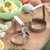 Rada Cutlery Food Choppers on a cutting board beside ingredients for potato salad