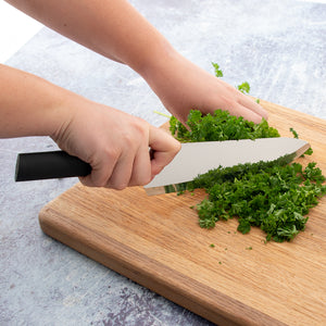 French Chef Knife in use mincing herbs