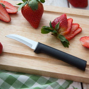 Granny Paring Knife with black handle shown on wooden cutting board with sliced strawberries