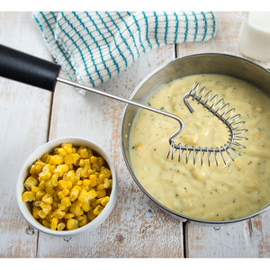 Unique Handi-Stir with black handle by corn chowder and a bowl of corn