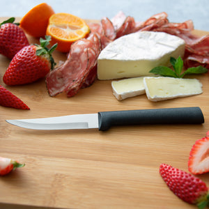 Heavy Duty Paring knife with black handle on wooden cutting board. 