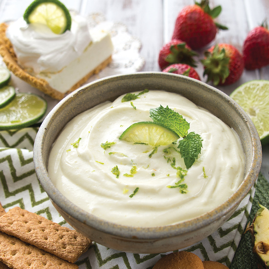 Key Lime Sweet Dip garnished with lime wedges.