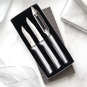 Kitchen Basics Gift Set with silver handles on two knives and a vegetable peeler in gift box. 