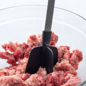 Different angle of Meat Chopper chopping raw beef in a bowl.